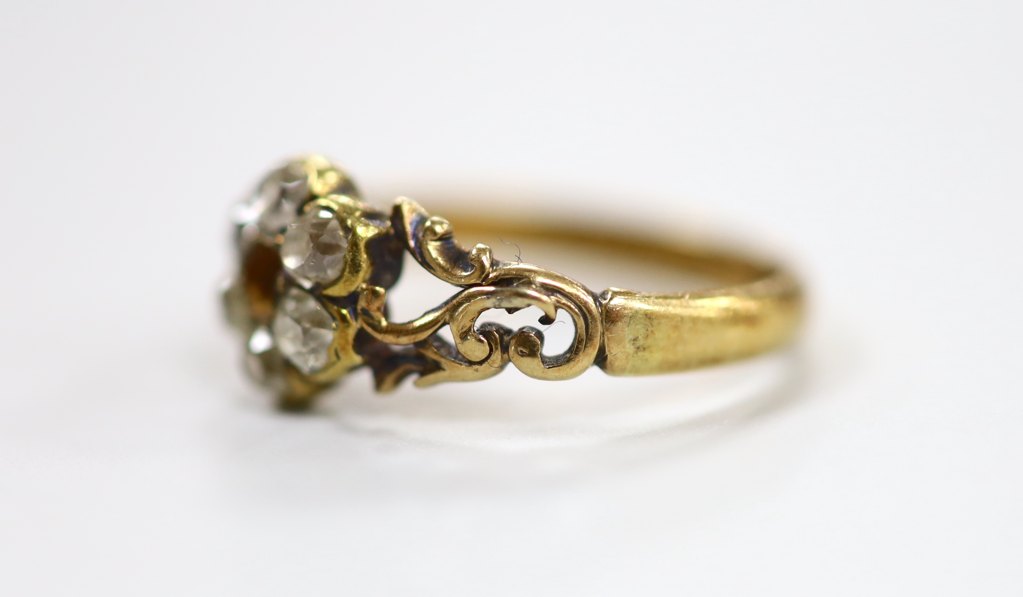 A late Victorian 18ct and diamond cluster set ring (stone missing), size P/Q, gross weight 3.6 grams.